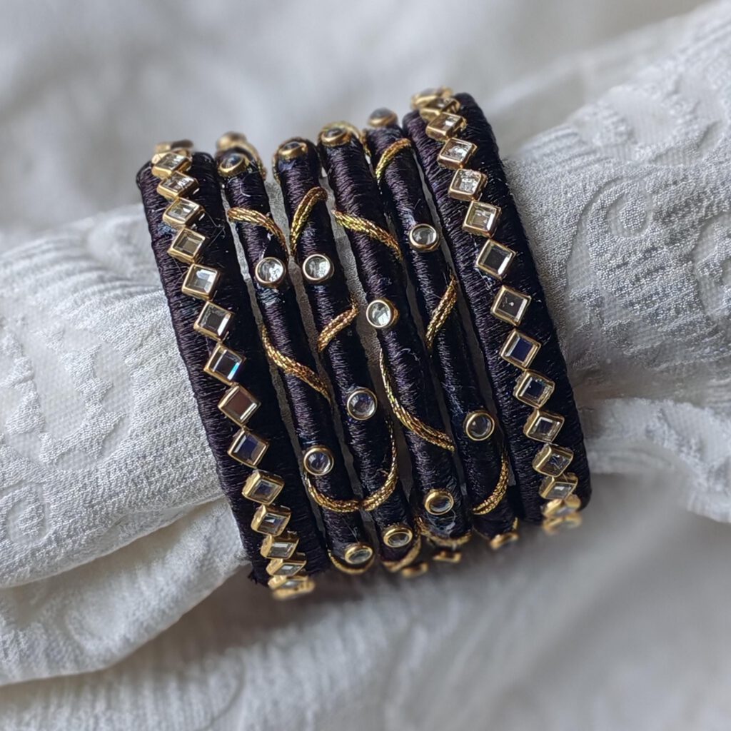 Dark purple silk thread bangles with gold wire and clear stones