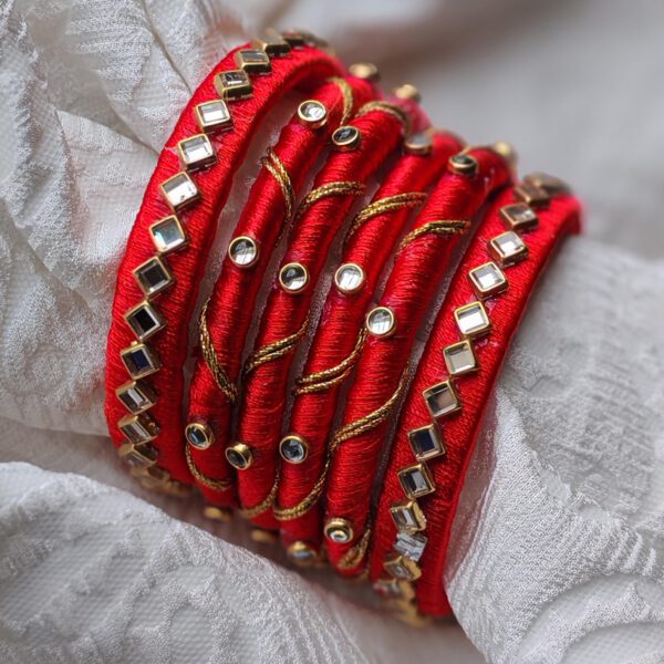 Red silk thread bangles with gold wire and kundan stones